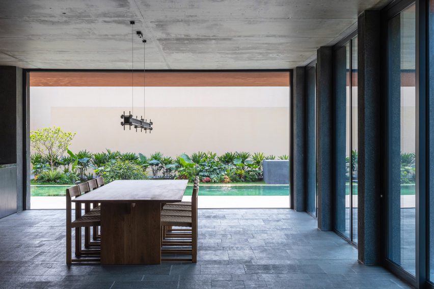 Dining room and pool at a multi-generational home in Vietnam
