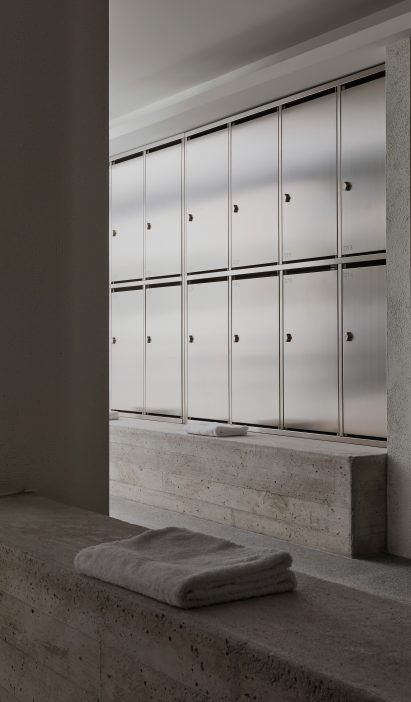 Concrete benches in factory changing rooms in San Sebastian by Ortega Diago