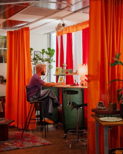 Public Art Company founder Raffi Lehrer sat at the desk he created for the studio