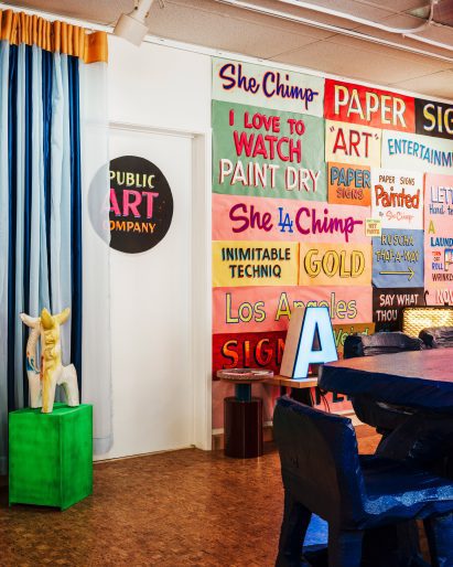 Colourful text graphics by Ben Klevay cover one wall