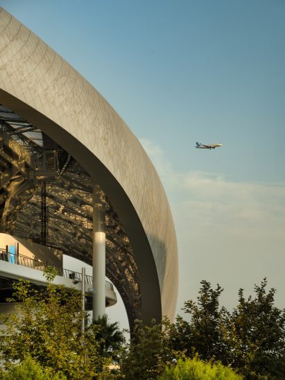 SoFi stadium with an airplane