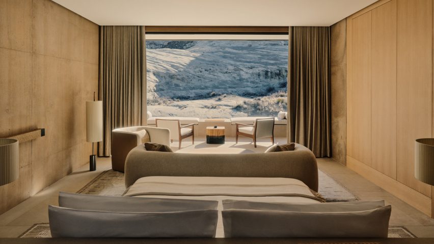 Bedroom with desert landscape outside the window