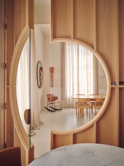 View through circular window in Apartment 21 by Piercy & Company
