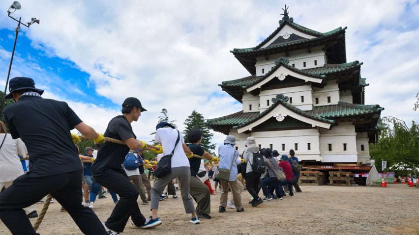 Hirosaki Castle pulled by volunteers in Japan