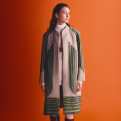 Woman in green and white coat