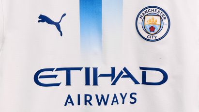 White kit with blue stripe