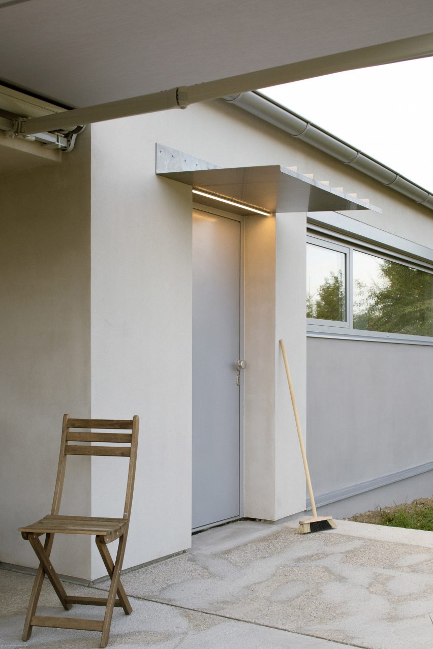 Modular home with sloping facade by Papundekl Architects