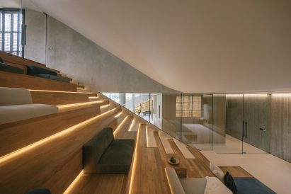 Stepped TV room at Split Mass Residence in Indonesia by K-Thengono Design Studio
