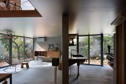 Ground floor interior at House in Shichiku by Tato Architects