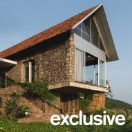 Ushas farmhouse with a pitched tiled roof and cantilevered upper floor