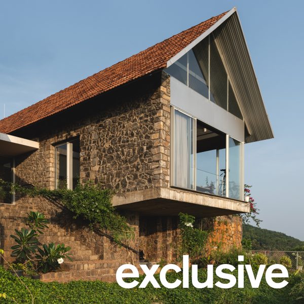 Ushas farmhouse with a pitched tiled roof and cantilevered upper floor