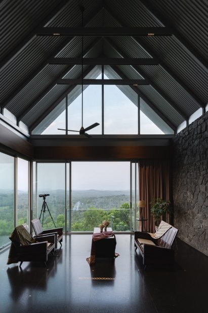 Ushas farmhouse interior beneath a pitched roof with mountain views