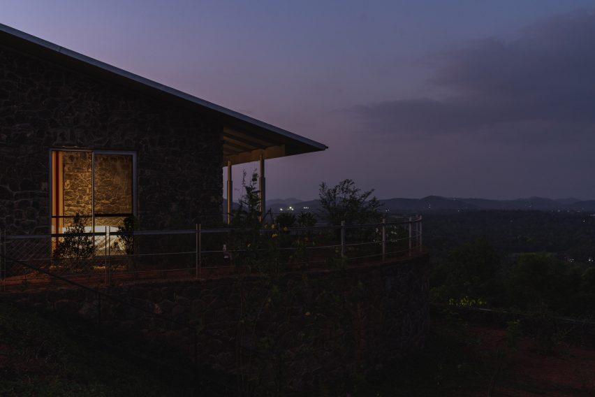 Night view of Ushas farmhouse overlooking hills