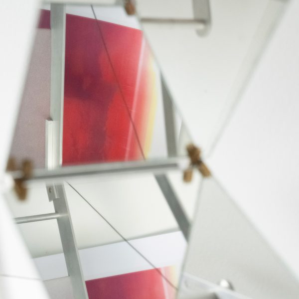 Photo of red art reflected in a mirror