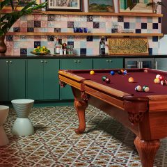 Colourful kitchen with billiard table in the middle