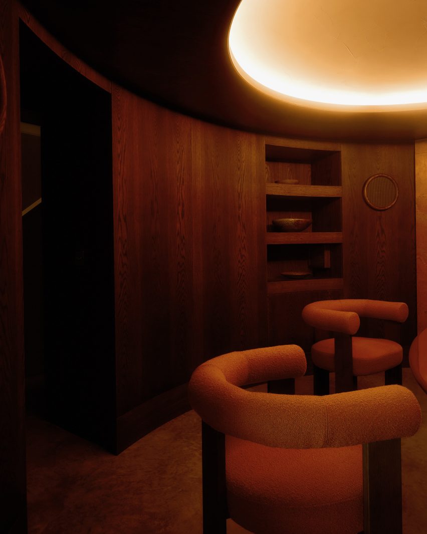 Dark timber dining room by Anam Design Studio