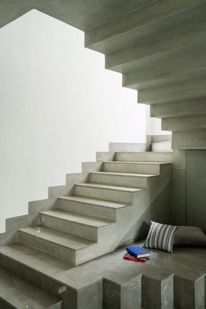 Concrete staircase with reading nook