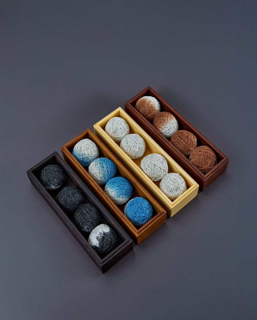 Four narrow boxes containing Hanji-covered balls