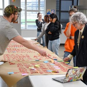 Photo of people with a paper banner