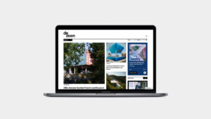 Dezeen website homepage on laptop