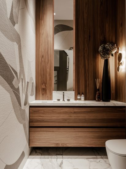 The guest bathroom featuring horse patterned wallpaper