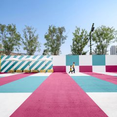 Colourful outside space with blue, white and pink flooring