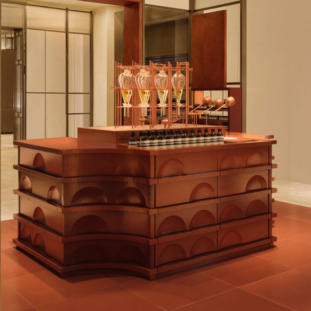 Al-Jawad Pike refreshes Aesop store with terracotta-tiled counter evoking ancient Persia