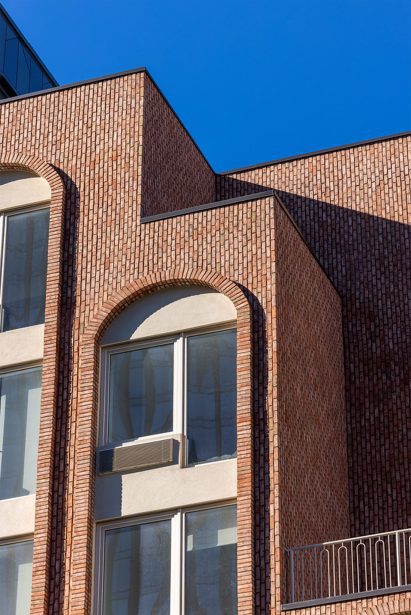 Glen-gery bricks frame windows of 540 Atlantic in Brooklyn