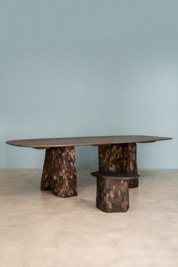 Table clad in wooden shingles