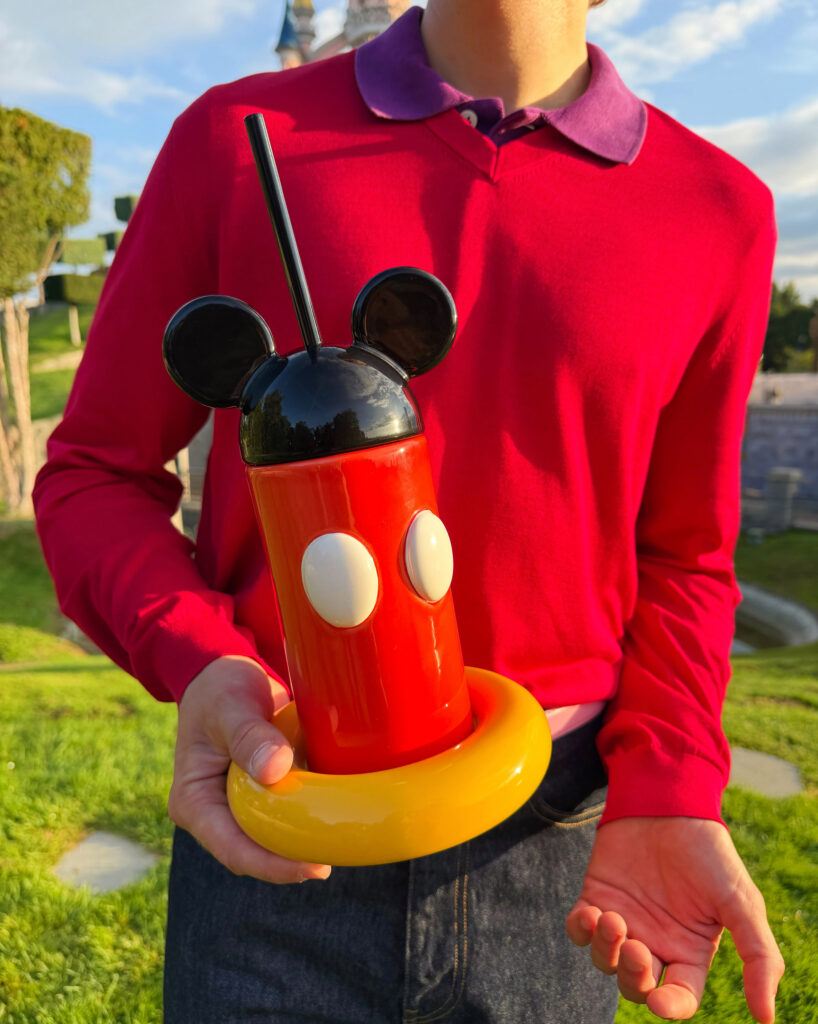 Man holding Mickey Mouse tumbler
