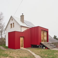 Facha Architekti adds “deliberately distinct” red extension to former-pigsty home