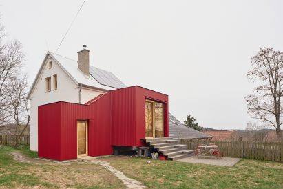 the extension adds seating steps and a terrace to improve outdoor access