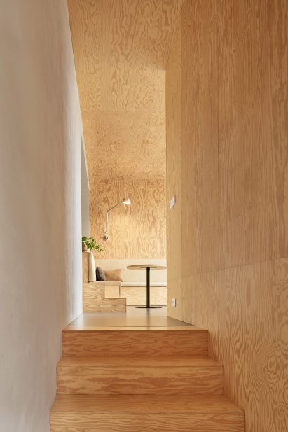 pine cladding covers stairs, walls and ceiling in this newly developed Czech home 