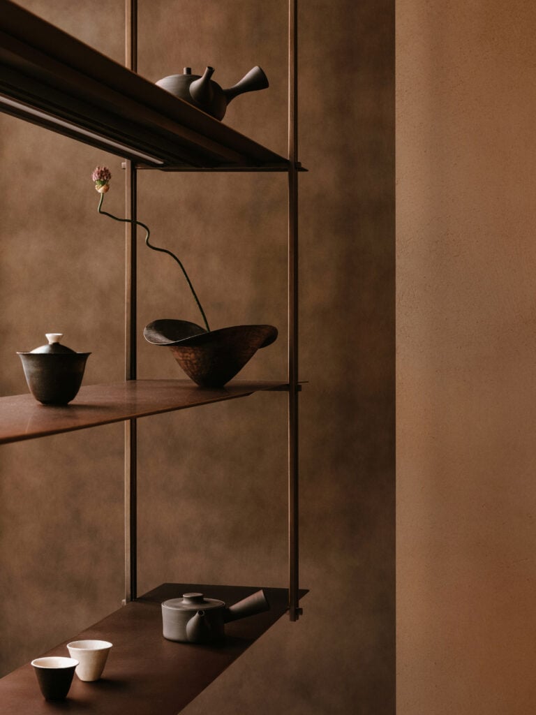 Teapot in dark window