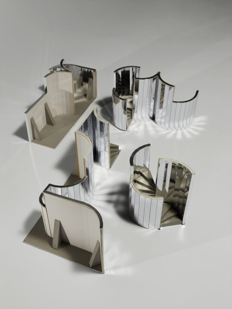 A scale model of a maze made from mirrored partitions