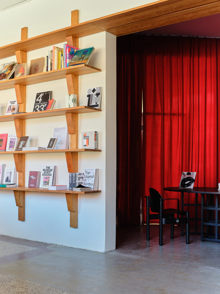 Cherry wood shelves by Derya Arpaç in Simone Book Services