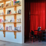Cherry wood shelves by Derya Arpaç in Simone Book Services