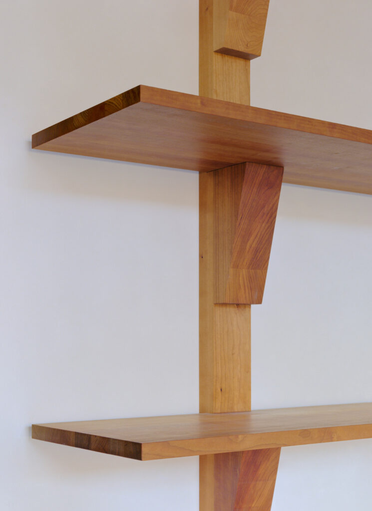 Cherry wood shelves by Derya Arpaç in Simone Book Services