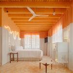 Orange bedroom in Terreno Barrio Hotel in Palma by OHLAB